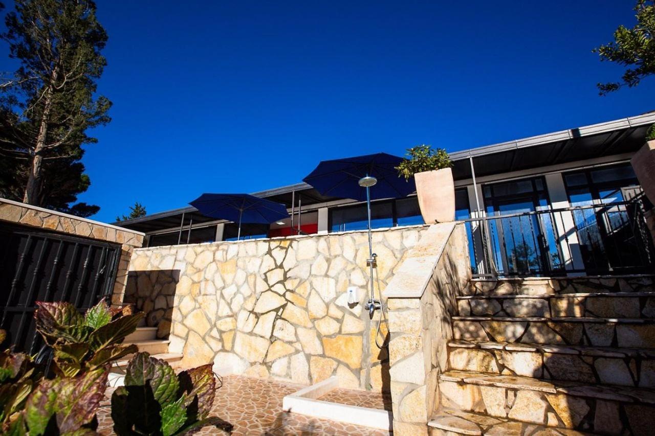 Beachfront Red Apartments With Pool Bar Exterior photo